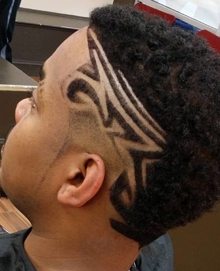 Curly cut with unique design haircuts for black men