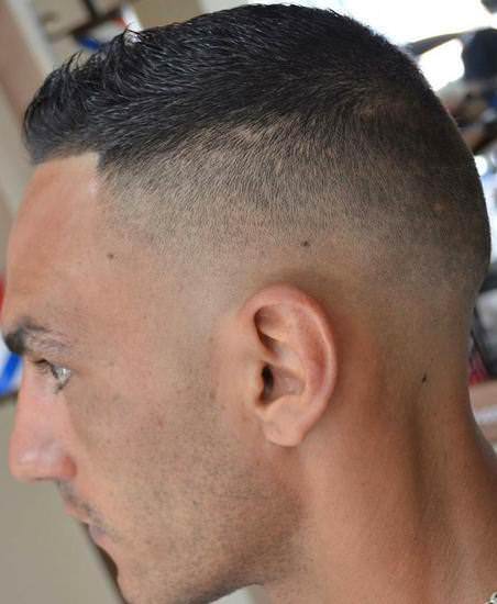 Dark high and tight sporty haircuts for men