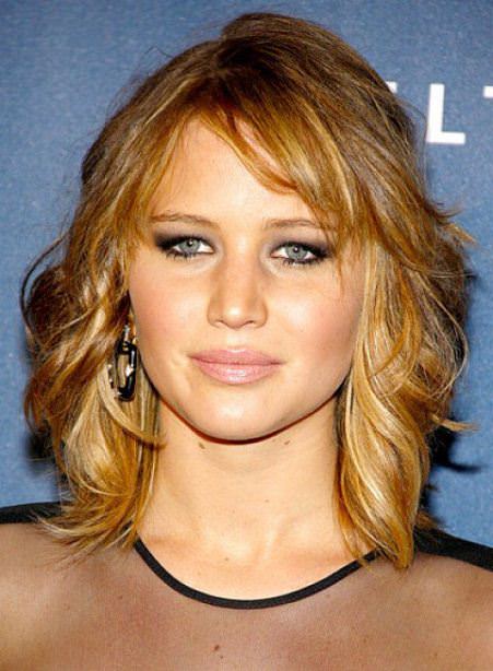 curled golden medium length haircuts for thick hair
