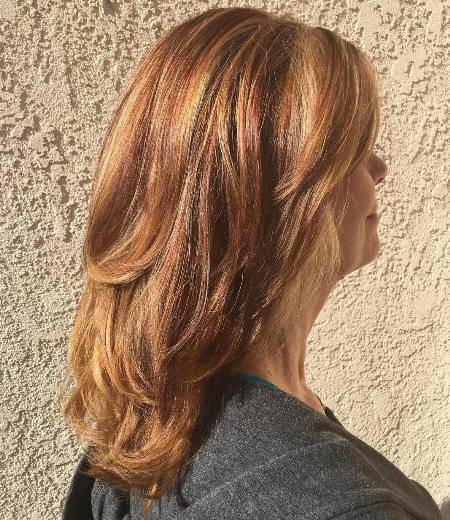 golden and red layered hairstyles for women over 40