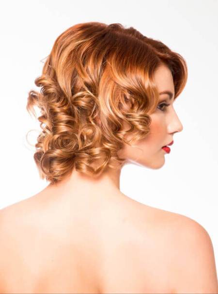 loose copper curls with side bangs short hairstyles for round faces