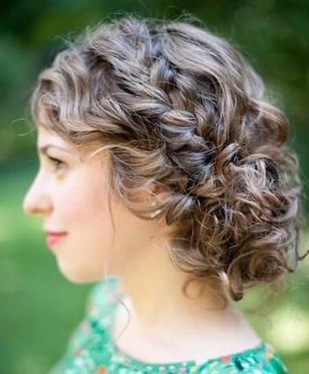 messy braid with bun and crown updos for curly hair