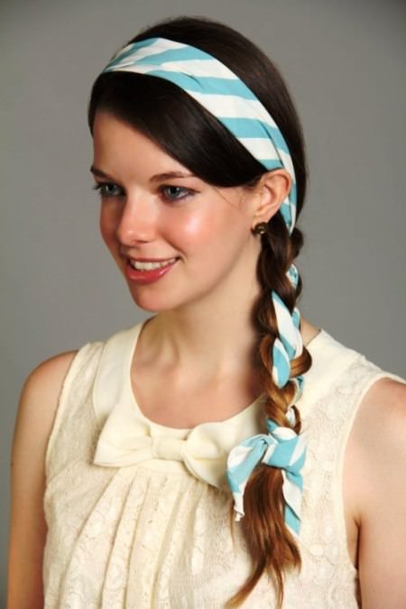 side braid with a scarf headband mid-length hairstyles
