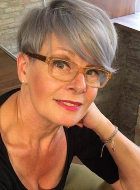 Cropped gray with swooped bangs hairstyles for older women