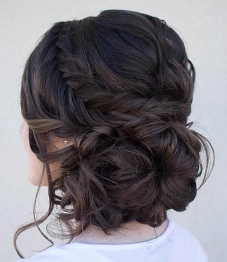 curly side bun and a fishtail braid casual Updos for long hair