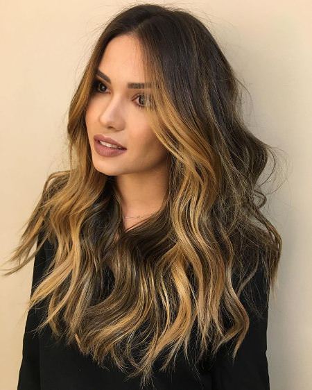 layered brown hair with golden balayage highlights long brown hairstyles