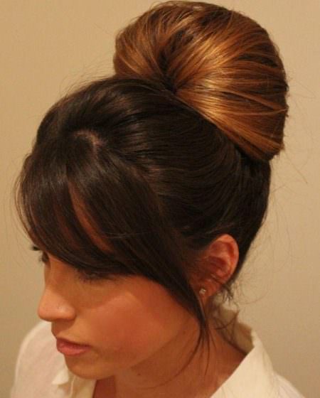 simple bun with side swept bangs updos for long hair