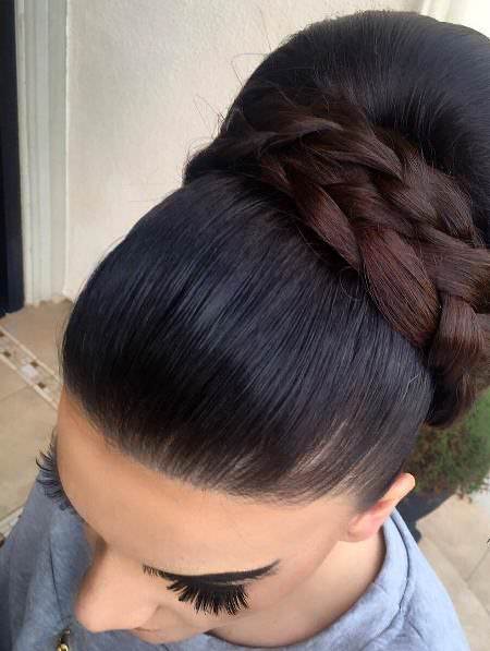 Classic updo with thick accent bun hairstyles for long hair