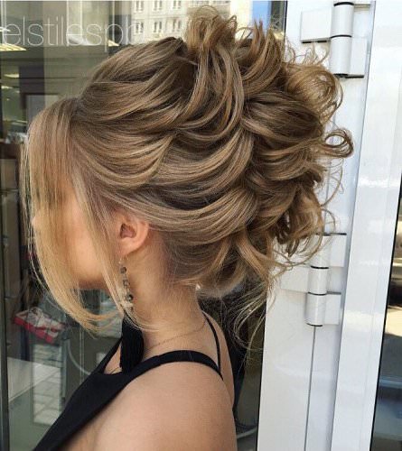 Elegant curled prom style bun hairstyles for long hair