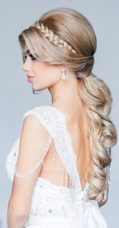 braided pony with a bouffant and dropped curls beach wedding hairstyles