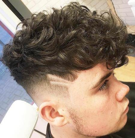 curly crop with side designs hairstyles for men with thick hair