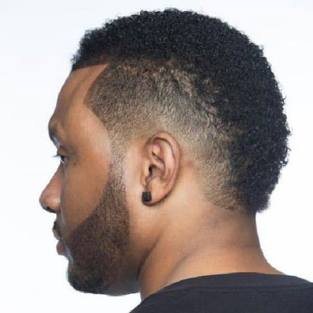 curly faux hawk with a side part curly hairstyles for black men