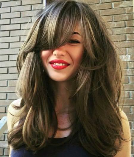 long layered hairstyle with side swept bangs hairstyles for long thick hair