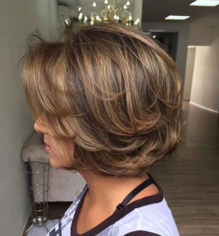 rounded bob with swoopy layers haircuts for women over 60