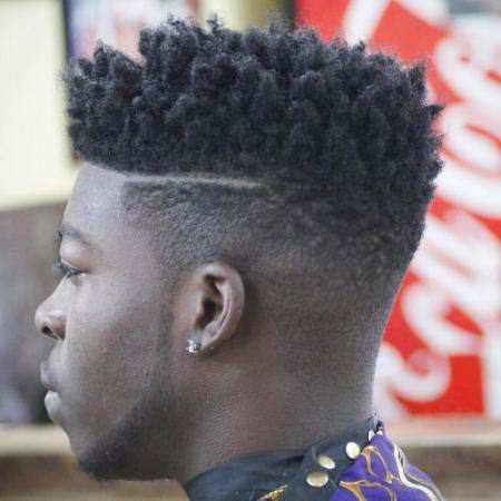 taper fade with kinky top curly hairstyles for black men