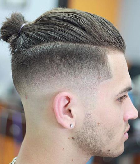 tapered fade with bun hairstyles for balding men