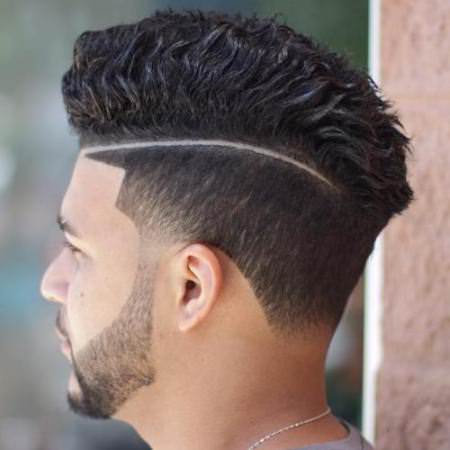 thick waves with a designed part haircuts for men