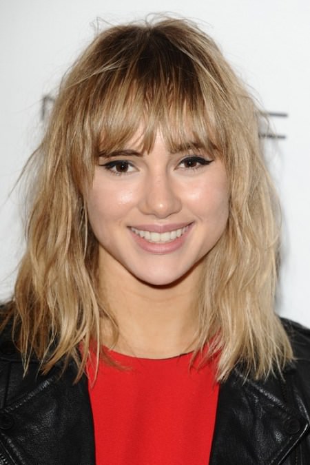 trendy mid length hairstyle with a fringe fringe hairstyles