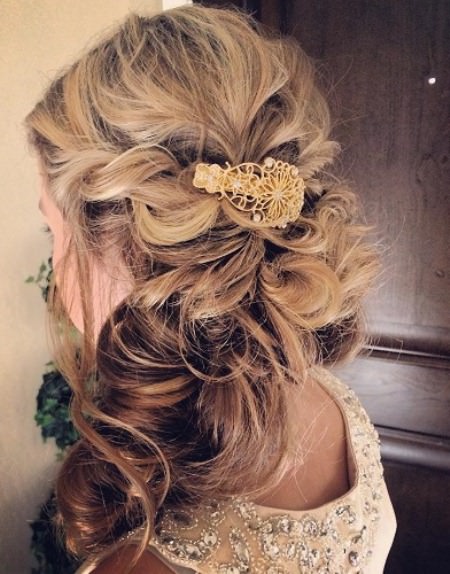 curled clipped to the sidehalf up and half down wedding hairstyles