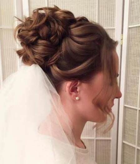 curly bridal bun with veil wedding hair updos for elegant brides