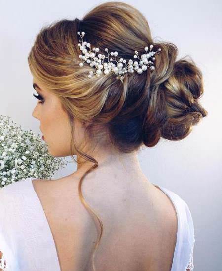 curly updo with bouffant wedding hair updos for elegant brides