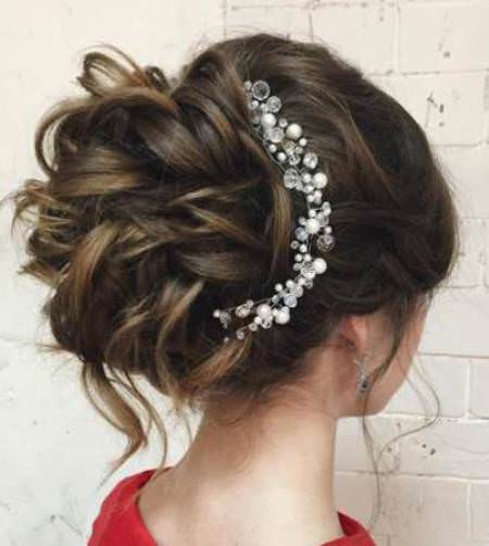 large curly bun with beaded clip wedding hair updos for elegant brides