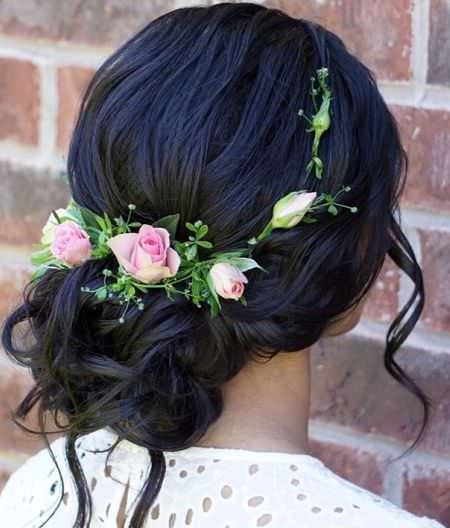 undone low bun with floral headband wedding hair updos for elegant brides