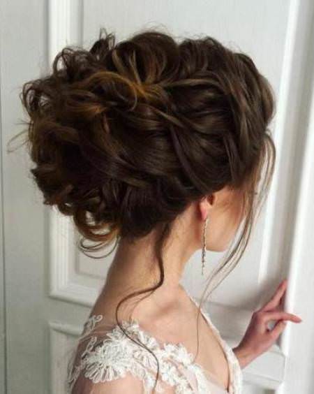 woven updo and tendrils wedding hair updos for elegant brides