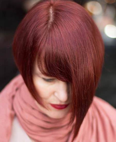 asymmetrical auburn cut shades of red hair for women