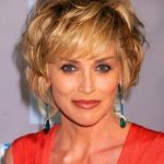 playful curls with short fringe haircuts for women over 50