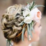 Curled floral bun hairstyles for long hair