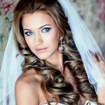 half up long curly hair with a veil wedding curly hairstyles